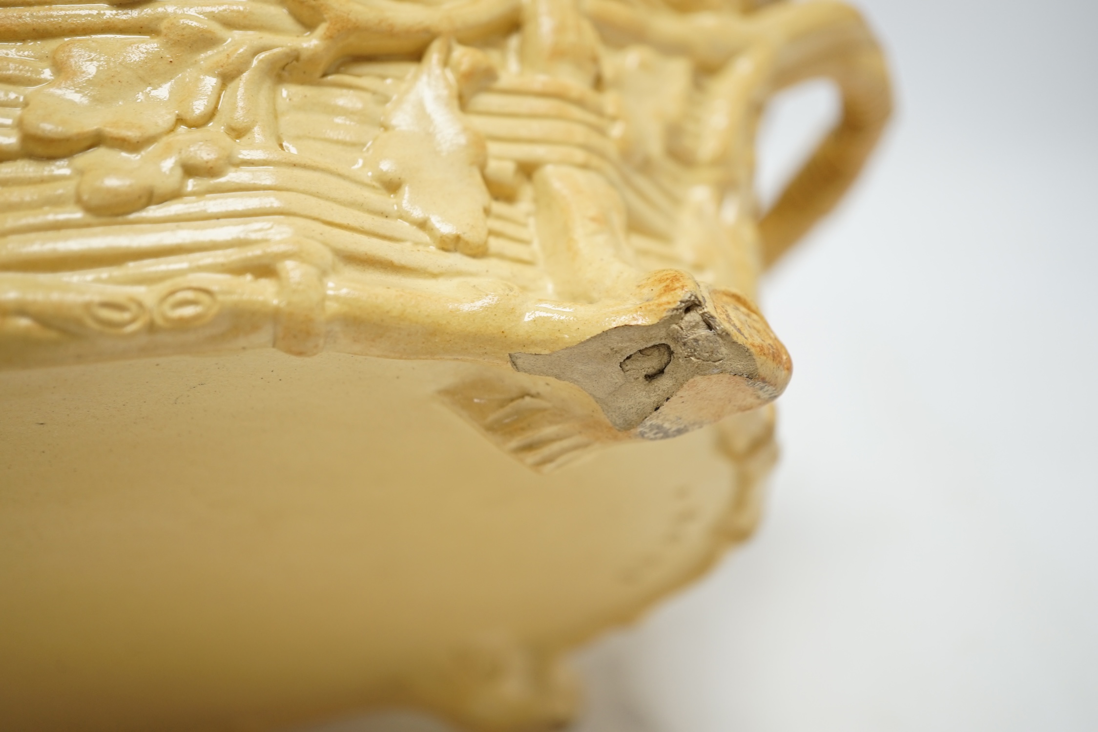 A 19th century Minton caneware game pie dish and cover, 33cm wide. Condition - acorn leaf tip and wing tip missing on cover, small chips to inner lip of tureen.